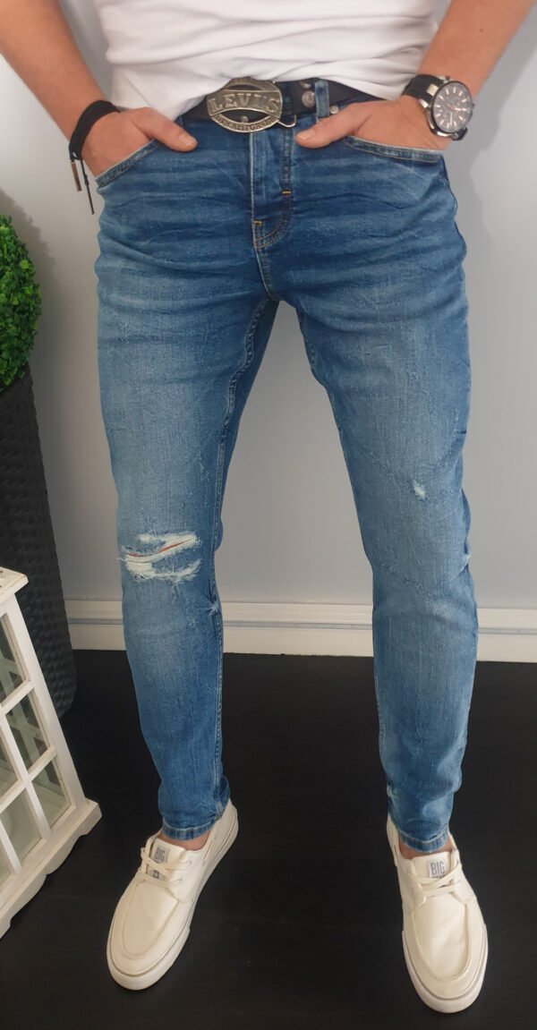 Spodnie męskie jeansy z dziurami