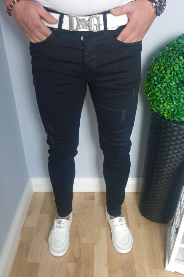 Czarne spodnie jeansowe męskie z przetarciami